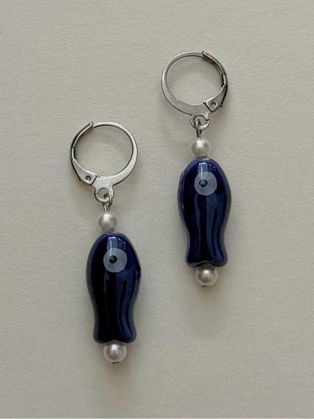 stainless steel mini ceramic fish + pearl huggie hoop earrings